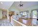 Large living room with vaulted ceiling, hardwood floors, and sectional sofa at 5357 Cobblestone Ct, Wesley Chapel, FL 33543