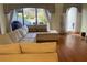 Spacious living room with hardwood floors and large sectional sofa at 5357 Cobblestone Ct, Wesley Chapel, FL 33543