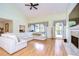 Large living room with vaulted ceiling, hardwood floors, and sectional sofa at 5357 Cobblestone Ct, Wesley Chapel, FL 33543