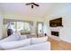 Living room with vaulted ceiling, fireplace and hardwood floors at 5357 Cobblestone Ct, Wesley Chapel, FL 33543
