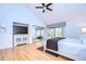 Large main bedroom with high ceilings, king bed, and access to private patio at 5357 Cobblestone Ct, Wesley Chapel, FL 33543