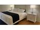 Main bedroom with double nightstands and white bedding at 5357 Cobblestone Ct, Wesley Chapel, FL 33543