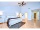 Large main bedroom with high ceilings, king bed, and access to private patio at 5357 Cobblestone Ct, Wesley Chapel, FL 33543
