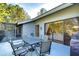 Spacious patio with seating and access to the interior through sliding doors at 5357 Cobblestone Ct, Wesley Chapel, FL 33543