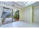View of a private patio accessible through sliding glass doors at 5357 Cobblestone Ct, Wesley Chapel, FL 33543
