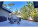 Relaxing patio featuring a table and chairs, great for outdoor dining at 5357 Cobblestone Ct, Wesley Chapel, FL 33543