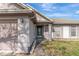 Charming home featuring a decorative front door, light gray paint, and manicured lawn at 7908 E White Water Ct, Tampa, FL 33637
