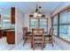 Bright dining area with wood table and chairs, adjacent to the kitchen at 807 Belle Timbre Ave, Brandon, FL 33511