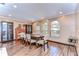 Bright dining room with hardwood floors, large windows, and a wooden table at 807 Belle Timbre Ave, Brandon, FL 33511