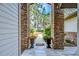 View through brick columns to a walkway and lush landscaping beyond at 807 Belle Timbre Ave, Brandon, FL 33511