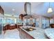 Updated kitchen with granite island, stainless steel appliances, and ample counter space at 807 Belle Timbre Ave, Brandon, FL 33511