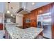 Island kitchen with granite countertops, stainless steel appliances, and ample cabinetry at 807 Belle Timbre Ave, Brandon, FL 33511