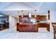 Modern kitchen with granite countertops, stainless steel appliances, and an island at 807 Belle Timbre Ave, Brandon, FL 33511