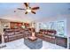 Open living room with vaulted ceiling, leather furniture and views to kitchen at 807 Belle Timbre Ave, Brandon, FL 33511