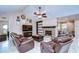 Spacious living room with a fireplace, built-in shelving, and leather sofas at 807 Belle Timbre Ave, Brandon, FL 33511