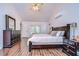 Main bedroom with king bed, hardwood floors and private access at 807 Belle Timbre Ave, Brandon, FL 33511