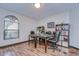 Home office with two desks, built-in shelving, and hardwood floors at 807 Belle Timbre Ave, Brandon, FL 33511