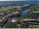 Beautiful aerial view of homes near a lake, baseball fields, and a water tower at 165 Nina Way, Oldsmar, FL 34677