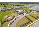 Aerial view of community pool, playground, and parking at 16743 Carlton Pond St, Wimauma, FL 33598
