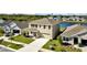 Two-story house next to a lake in a residential area at 16743 Carlton Pond St, Wimauma, FL 33598