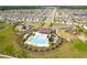Aerial community view with pool and playground at 16743 Carlton Pond St, Wimauma, FL 33598