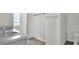 Bathroom with shower, double sinks, and toilet at 16743 Carlton Pond St, Wimauma, FL 33598