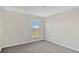 Simple bedroom with carpeted floor and a window at 16743 Carlton Pond St, Wimauma, FL 33598