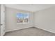 Bright bedroom with window and community view at 16743 Carlton Pond St, Wimauma, FL 33598