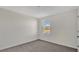 Simple bedroom with a window and neutral decor at 16743 Carlton Pond St, Wimauma, FL 33598