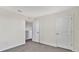 Bright bedroom with neutral walls, carpeting, and ample closet space at 16743 Carlton Pond St, Wimauma, FL 33598