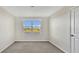 Bedroom with window overlooking a lake and community at 16743 Carlton Pond St, Wimauma, FL 33598