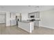 Modern kitchen with gray cabinets, granite countertops, and island at 16743 Carlton Pond St, Wimauma, FL 33598