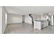 Bright and airy living room with tile floors and access to kitchen at 16743 Carlton Pond St, Wimauma, FL 33598
