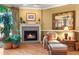 Living room with fireplace, comfortable seating, and hardwood floors at 354 Larboard Way, Clearwater Beach, FL 33767