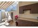 Outdoor kitchen with granite countertops and ample cabinetry at 354 Larboard Way, Clearwater Beach, FL 33767