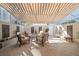 Outdoor patio with covered seating area and retractable awning at 354 Larboard Way, Clearwater Beach, FL 33767