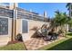 Private patio with checkered tile flooring, seating, and grill at 354 Larboard Way, Clearwater Beach, FL 33767
