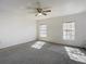 Bright bedroom with ceiling fan and mirrored closet doors at 4405 Vieux Carre Cir # 46, Tampa, FL 33613
