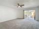 Bedroom with private balcony access and ceiling fan at 4405 Vieux Carre Cir # 46, Tampa, FL 33613