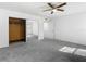 Bright bedroom with mirrored closet doors and ceiling fan at 4405 Vieux Carre Cir # 46, Tampa, FL 33613