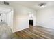 Dining area with wood-look flooring and view into kitchen at 4405 Vieux Carre Cir # 46, Tampa, FL 33613