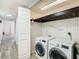 Laundry room with washer, dryer, and shelving at 4405 Vieux Carre Cir # 46, Tampa, FL 33613