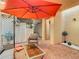 Relaxing brick patio with an umbrella and comfortable seating at 4405 Vieux Carre Cir # 46, Tampa, FL 33613