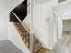 Staircase with metal railing leading to the upper level at 4405 Vieux Carre Cir # 46, Tampa, FL 33613