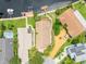 High-angle view of house, pool, and yard near the water at 6208 Spoonbill Dr, New Port Richey, FL 34652