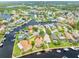 Aerial view highlighting the home's waterfront location and dock at 6208 Spoonbill Dr, New Port Richey, FL 34652