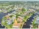 Bird's-eye view of a canal-front house with a spacious yard at 6208 Spoonbill Dr, New Port Richey, FL 34652