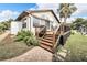 Elevated deck with stairs, offering canal views at 6208 Spoonbill Dr, New Port Richey, FL 34652
