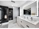 Elegant bathroom featuring a double vanity and walk-in shower at 6208 Spoonbill Dr, New Port Richey, FL 34652