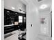 Black and white bathroom with a walk-in shower at 6208 Spoonbill Dr, New Port Richey, FL 34652